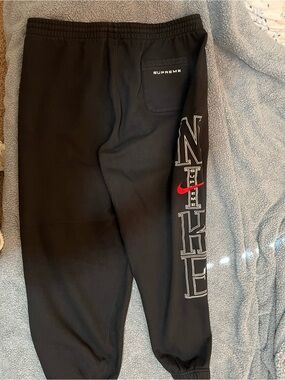 Supreme Black Joggers with White Outline Lettering and Red Swoosh